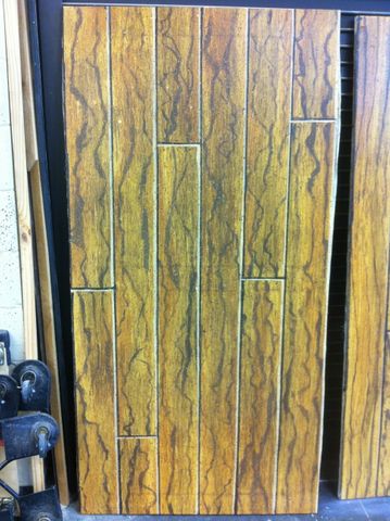 Scenic painting sample of faux wood planked flooring.