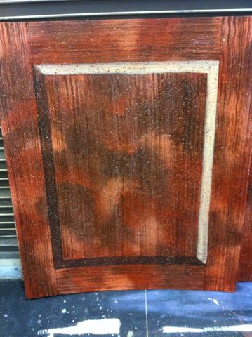 Scenic painting sample of faux wood with Tromp Loi raised paneling.