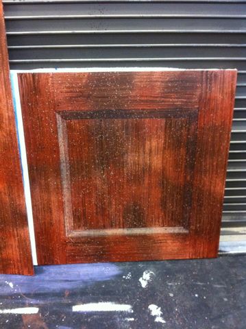 Scenic painting sample of faux wood with Tromp Loi recessed paneling.