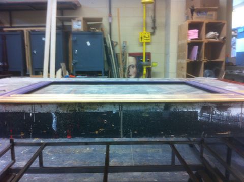 The art frame is dusted with gold spray paint from a low angle so that only outter faces get gold paint.