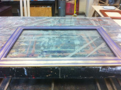 The art frame has an iridescent look from being pickeld with purple paint and then having the edges dusted with gold spray paint.