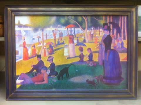 Compled fake art project with a framed painting. The frame is purple with an iridescent gold finish.