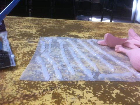 Process shot of a fake food project. Fake green beans are made from silicone caulk.