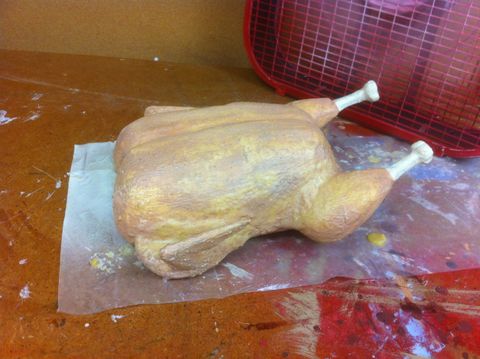 Process shot of a fake food project. Chicken parts are assembled and coated in a layer of latex to simulate the skin.