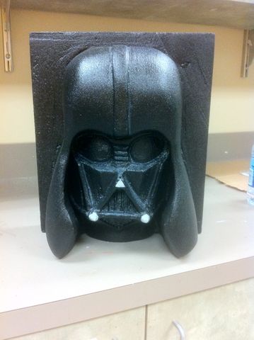 Final result of a foam carving project. It is a Darth Vader grotesque fully painted.