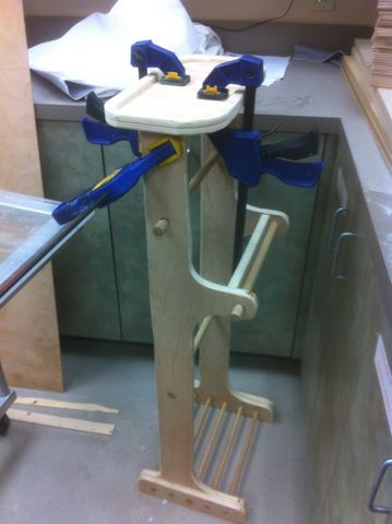 Process shot of constructing a pants butler from red oak plywood.