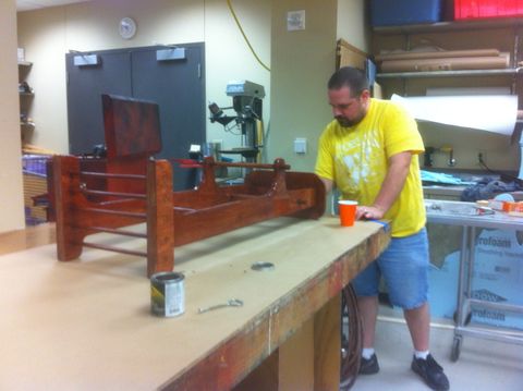 Process shot of polyurethane coating the pants butler.